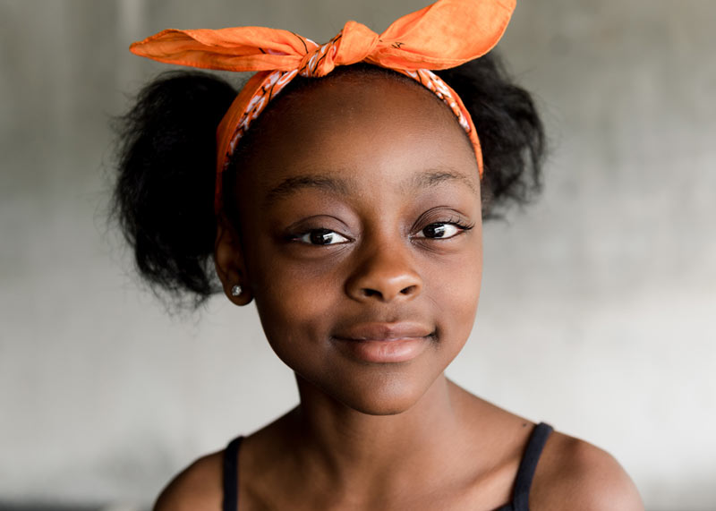 Girl with orange bow in her hair