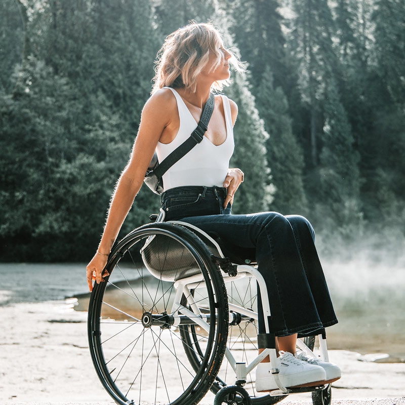 Girl in wheelchair enjoying sunshine