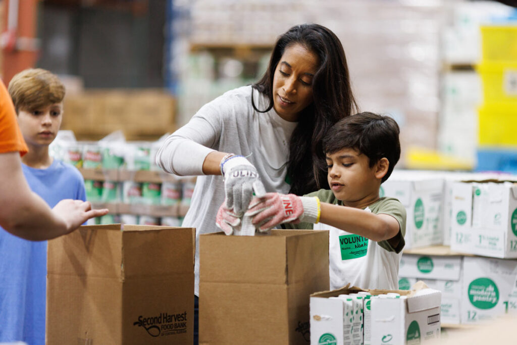 Kids volunteering to pack food boxes