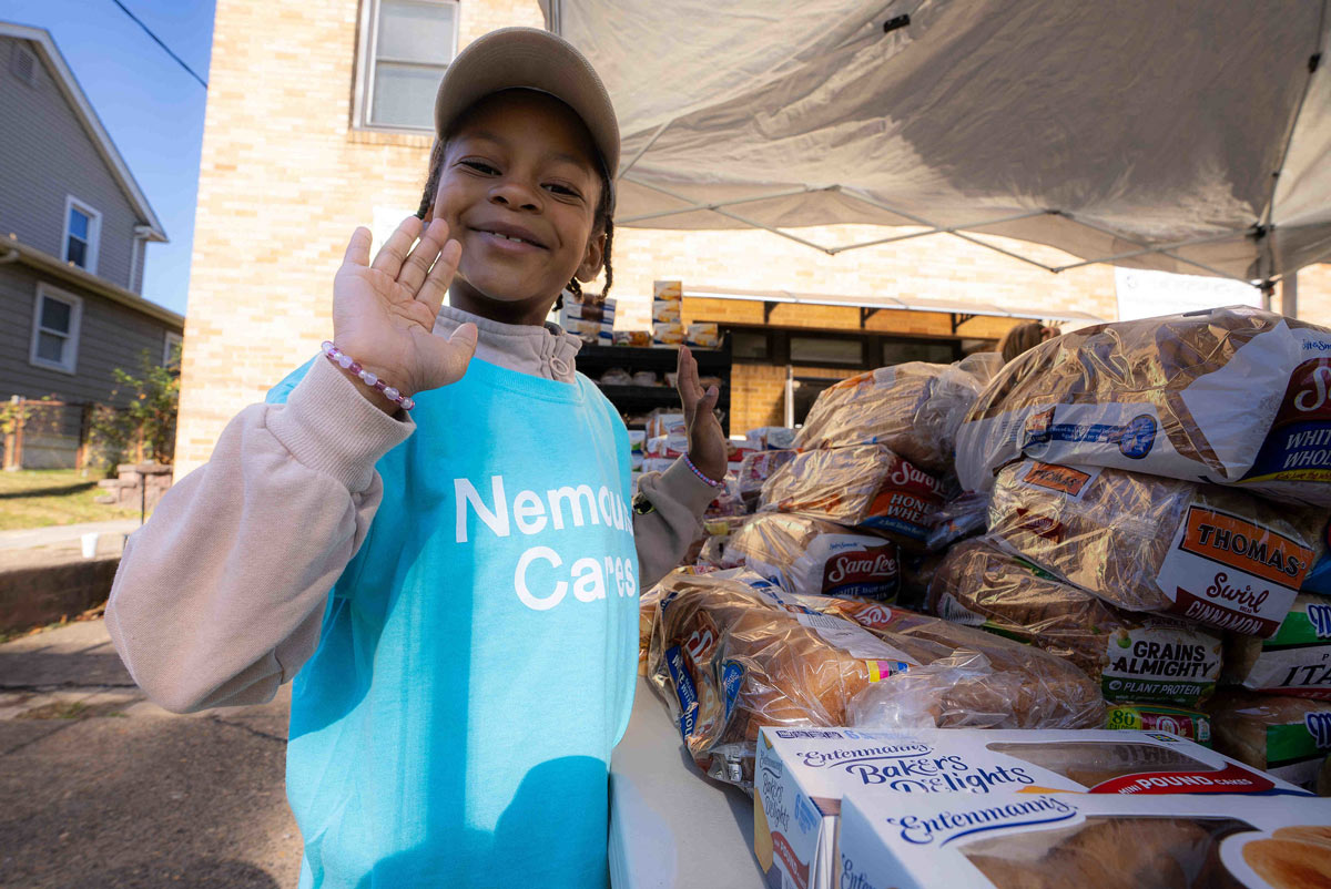 young food insecurity volunteers waving