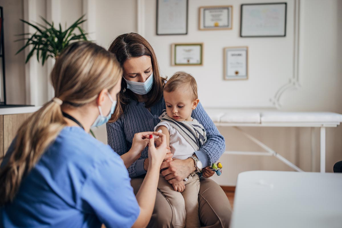 little boy getting vaccinated