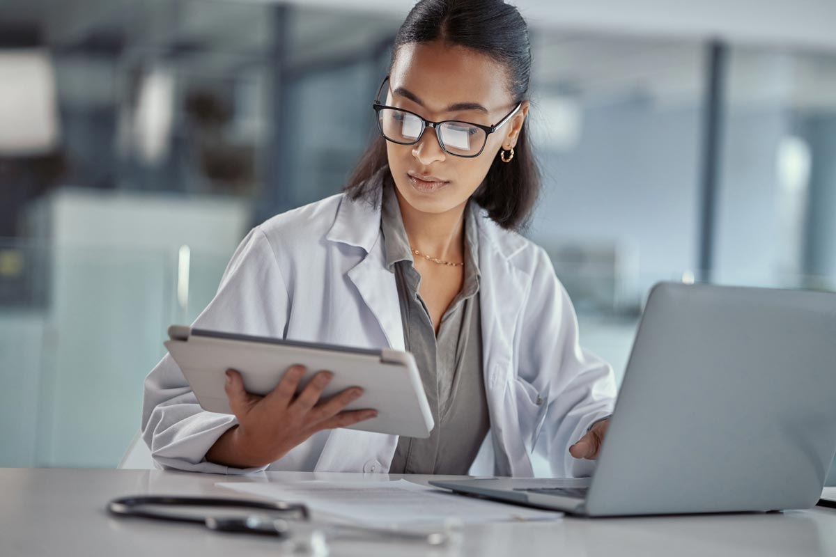 female doctor using a digital tablet at work