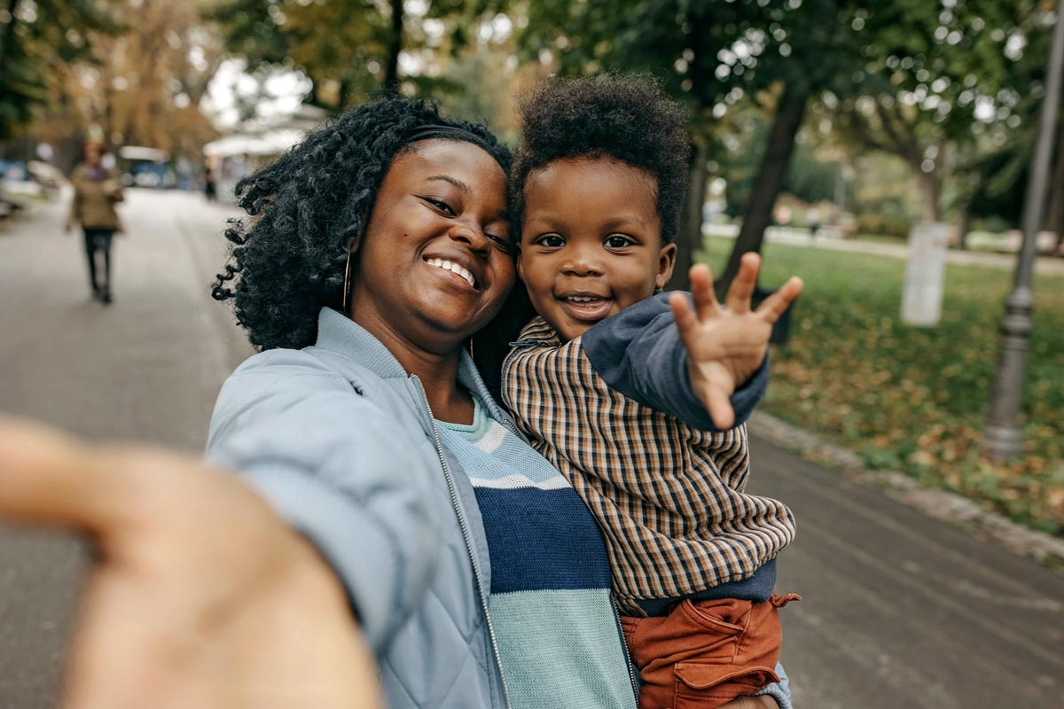 Happy mother and son hugging and spending time together