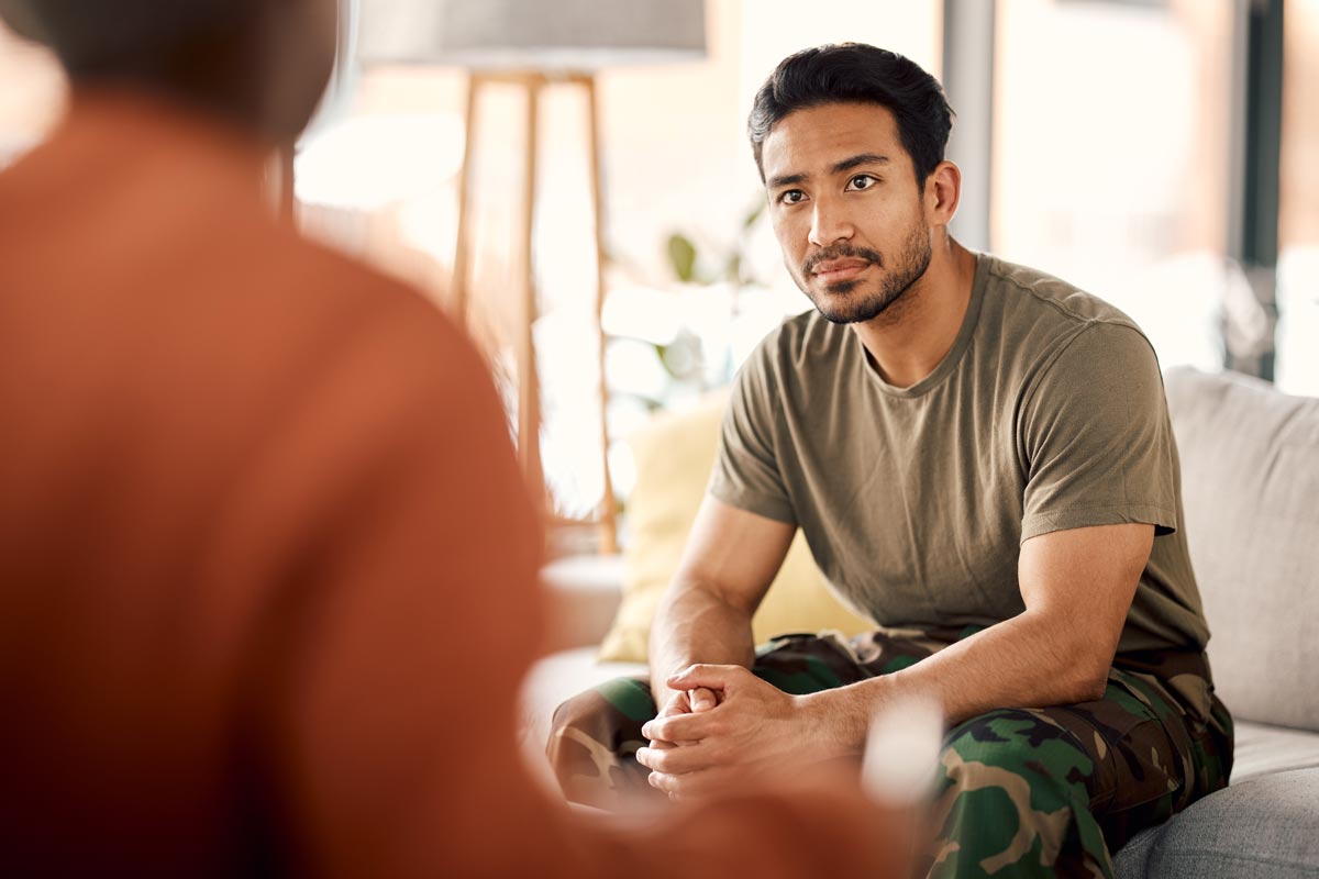 military man on therapist couch for mental health consultation