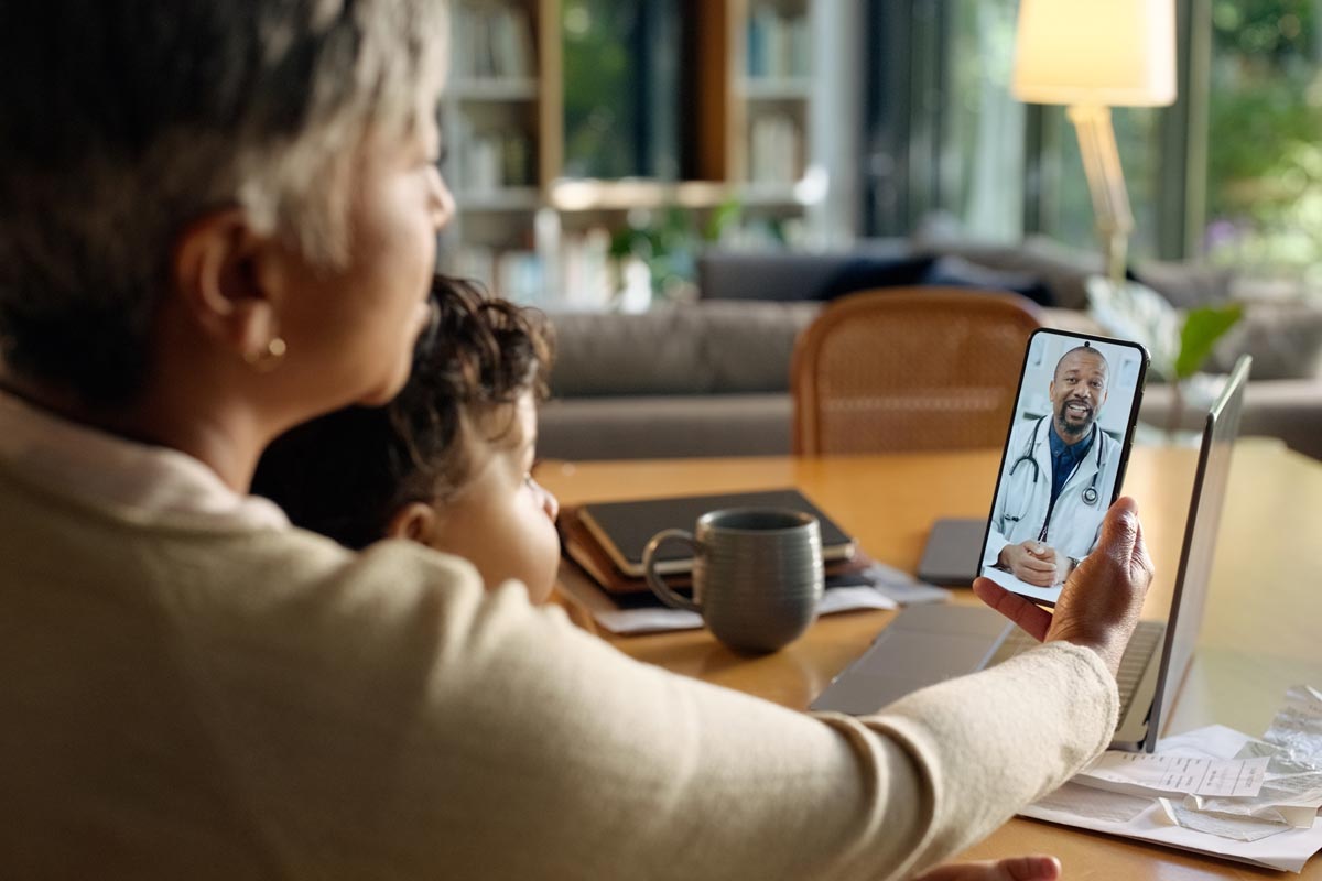 Video call, phone and parents with child for doctor for medical service, consulting and telehealth.